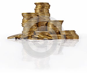 Piles of gold coins on a white