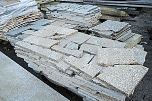 Piles of granite marble slabs on cutting factory