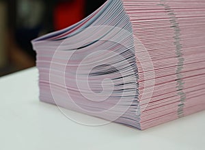 Piles of handout papers placed on table