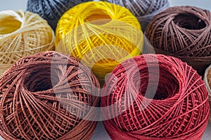 Piles of multi colored balls yarn background