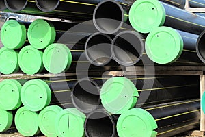 Piles of plastic pipes and conduits for transporting the gas