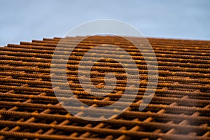 Piles of rusty rebar ready to be used at a construction site..