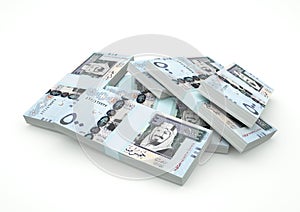 Piles of Saudi money isolated on white background