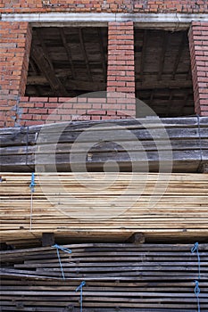 Piles stack of timber on construction site