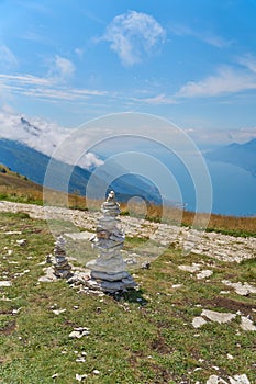 Piles of stones piled up by hikers on the summit of Monte Baldo on Lake Garda in Italy