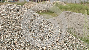 Piles of stones and sand in a building landscape