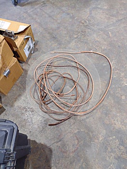 Piles of Stripped Copper Wire Inside Industrial Warehouse