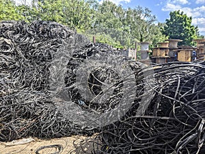 Piles of waste cables and reels