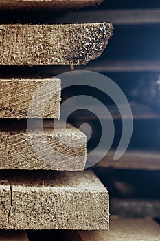 Piles of wooden boards in the sawmill, planking. Vertical. Copypast photo