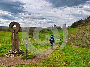 Pilgrim arriving in Aubrac. Camino de santiago.