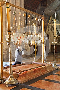 Pilgrim prays in a white veil