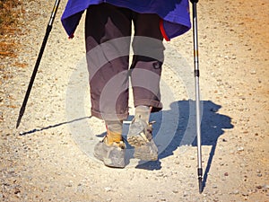 A pilgrim`s walk on hard stage in Palencia, Way of St. James, Spain