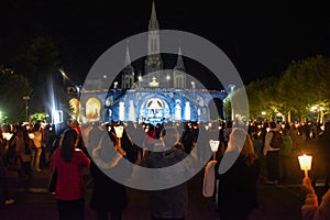 Pilgrims attend the Marian Torchlight Procession service at the Rosary Basilica in Lourdes