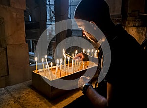 The pilgrims lit candles at the Church of the Holy Sepulchre