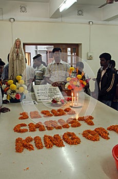Pilgrims pray beside the tomb of Mother Teresa in Kolkata, India