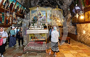 Pilgrims at Tomb of Mary holy place in Church of the Sepulchre of Saint Mary, known as Tomb of Virgin Mary, near Jerusalem, Israel