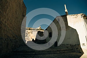 pilgrims walking a street in Castrojeriz town, province of Burgos, Spain - nov, 2021