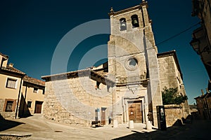 pilgrims walking a street in Castrojeriz town, province of Burgos, Spain - nov, 2021