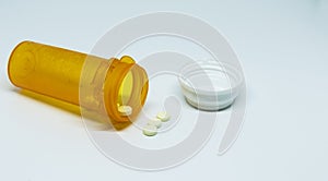 Pill bottle with drugs spilling out