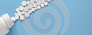 White round pills in a plastic bottle on a blue background for use in presentations, manuals, design, etc. 3D illustration.