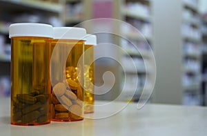 Pill bottles on a pharmacy counter in the dispensary