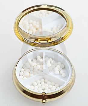 Pill box with sugar homeopathy balls