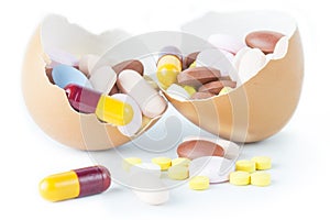 Pill capsule into egg shell broken concept idea health.