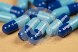 pill capsules and two shades of blue