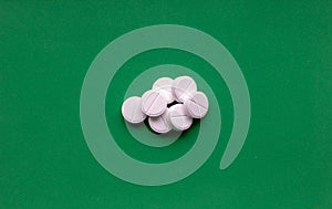Pill  on green background with clipping path photo