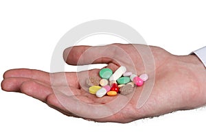 Pill in a hand on white background