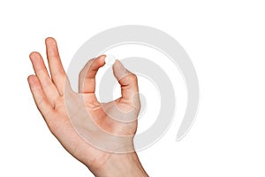 Pill in man`s hand on white background