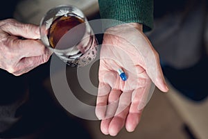 A pill in someone`s hand
