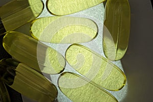 Pill supplements on a light and dark tray