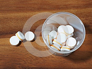 pill tablets on wood table background