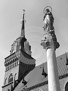 A pillar with a saint in front of a Church in the old market square in TarnÃ³w, Poland - POLSKA - CATHOLIC