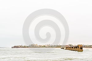 Pillars of old railroad bridge over the mouth Swakop River