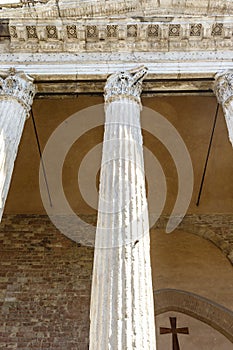 Pillars of the old Roman temple of Minerva and church of Santa Maria sopra Minerva, Assisi, Umbria, Italy