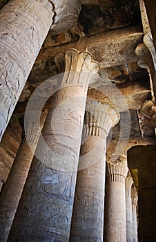 Pillars, reliefs and statue at the Edfu Temple. Nubia, Egypt