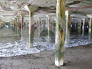 Pillars between sea and pier