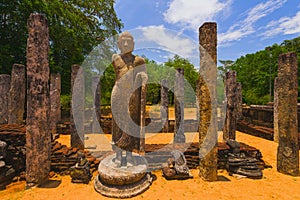 Pillars and standing Buddha in Polonnaruwa Sacred Quadrangle