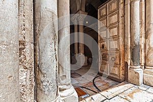 Pillars and wooden door of The Church of the Holy Sepulchre.