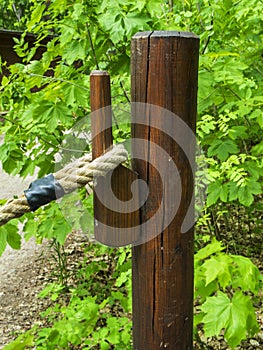 Pillars with wooden hooks and rope