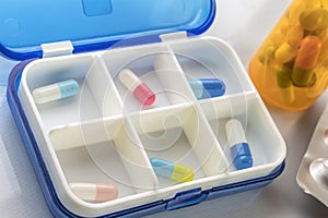 Pillbox with several capsules, daily medication