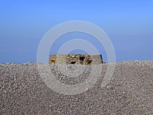 Pillbox on stone beach