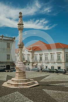 Pillory on square with old buildings at Estremoz