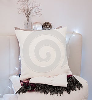 Pillow case Mockup. White pillow on bed in cozy bedroom. photo