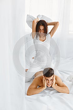 Pillow Fight. Couple having fun