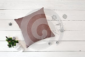 Pillow on a white wooden christmas background. Flat lay, top view photo mockup