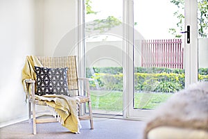 Pillow with a wooden chair and sheets beside a door