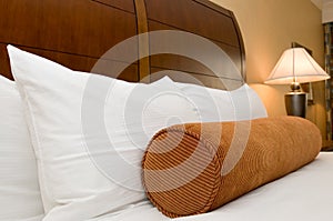 Pillows on bed in hotel room